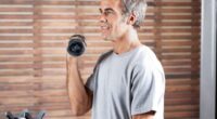 man doing bicep curls, concept of strength exercises for men to lose weight