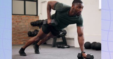 fit, muscular man performing renegade rows with dumbbells at the gym