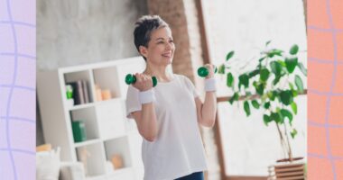 fit, mature woman lifting lightweight dumbbells in a bright living space