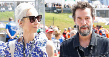 Keanu Reeves seen with gray beard as actor attends Moto GP with rarely-seen girlfriend Alexandra Grant