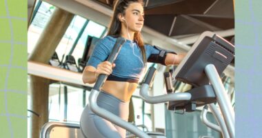 fit woman using an elliptical at the gym