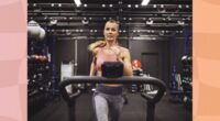 fit, focused woman running on treadmill at the gym