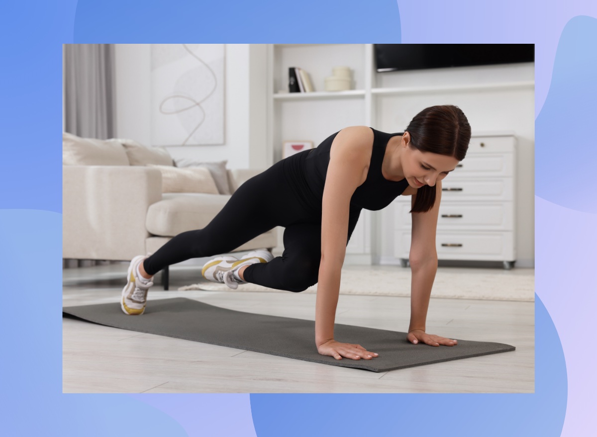 woman doing plank twist exercise on yoga mat in bright living room