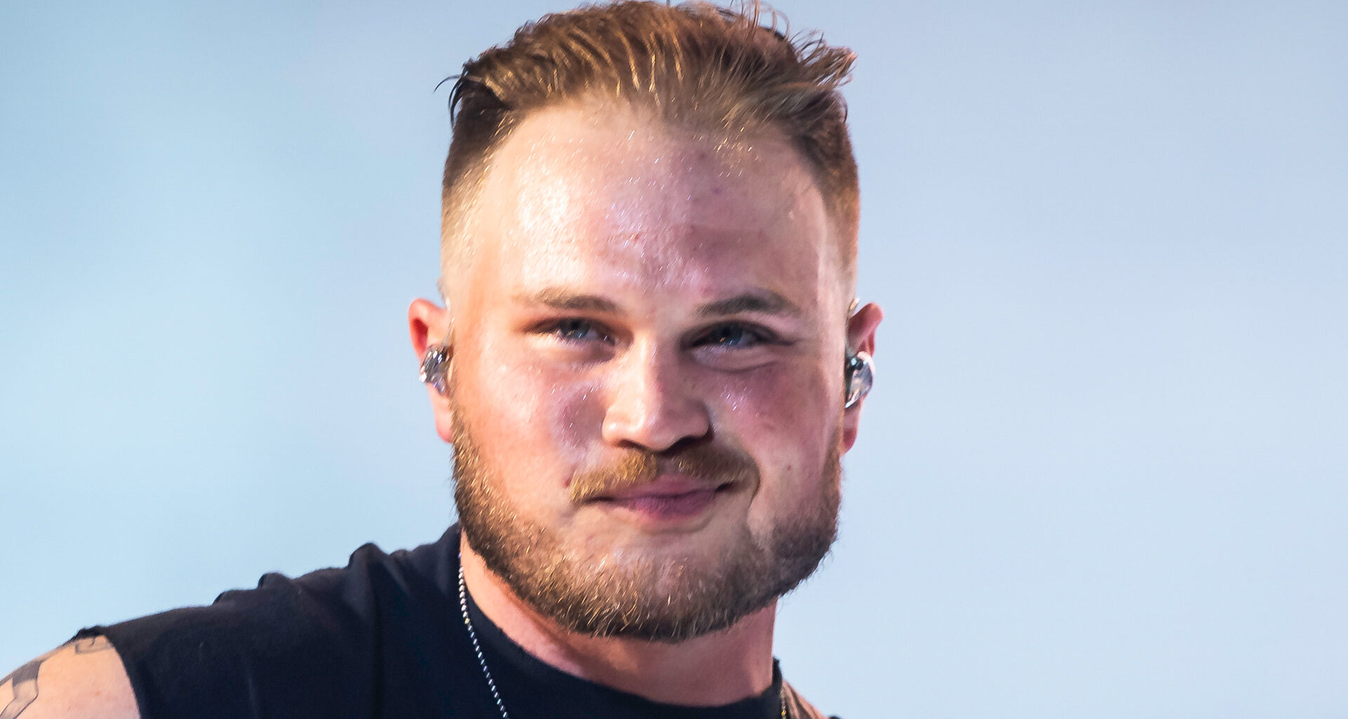 Watch the moment Zach Bryan falls off golf cart after crash as pal does a wheelie while backstage at New Orleans concert