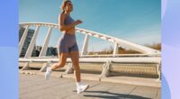 fit woman running outdoors on bridge on sunny day for exercise