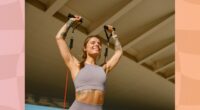 woman performing resistance band workout outdoors