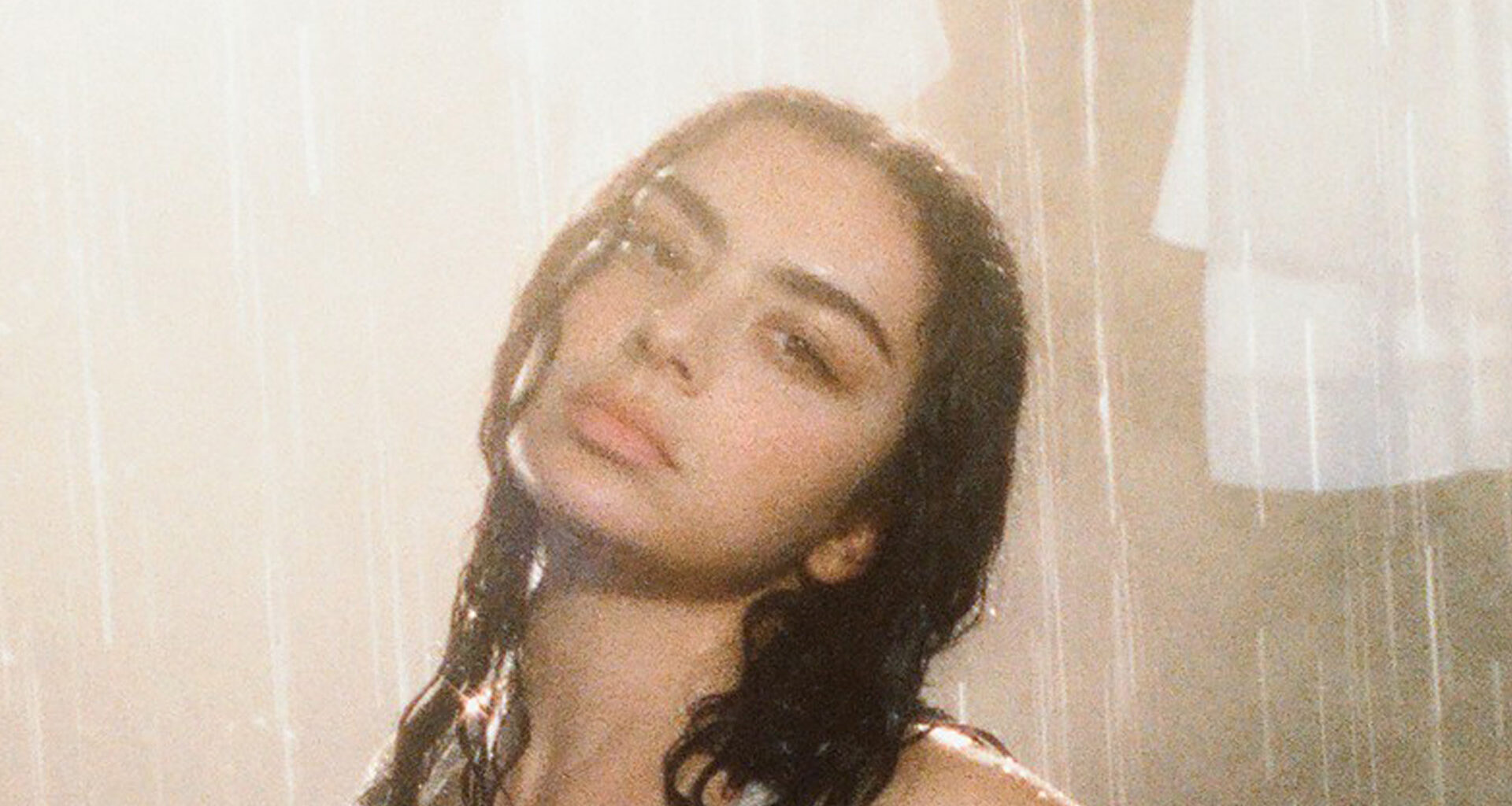 Charli XCX channels ‘Brat Summer’ energy in daring Skims promo as star models underwear in rain-soaked photoshoot