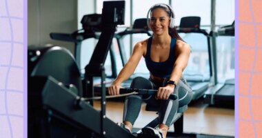 happy, fit woman performing a rowing machine workout in bright gym