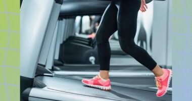 a photo of a person running on a treadmill incline on a designed wavy green background