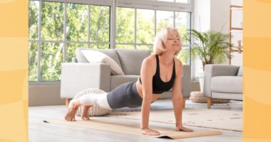 mature woman doing yoga exercise in her bright living space