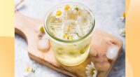 refreshing chamomile mocktail in a glass on a cutting board