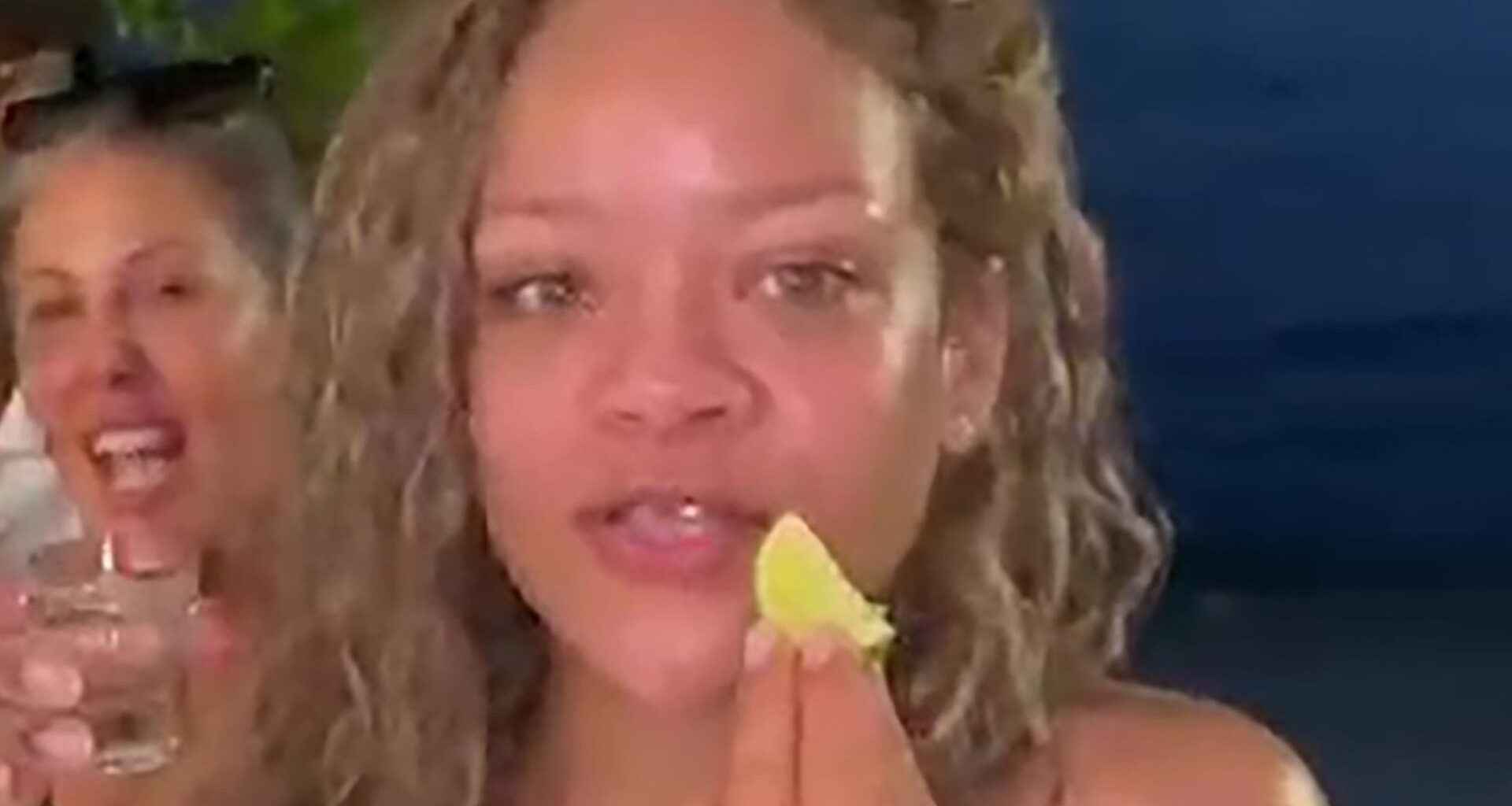 Rihanna goes makeup-free in a tiny bikini while enjoying shots with friends in Barbados as fans gush ‘she’s glowing!’