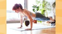 fit woman doing pushup exercise in bright living space