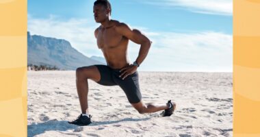 fit man doing walking lunges at the beach on sunny day