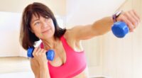 mature woman with dumbbells performing a breast lift workout