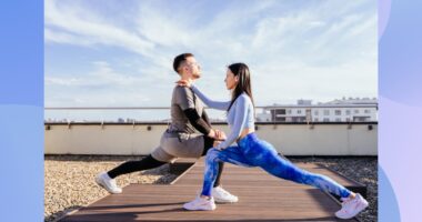 fitness couple doing lunges outdoors on rooftop workout space on sunny day