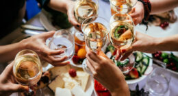 group cheers with drinks