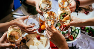 group cheers with drinks