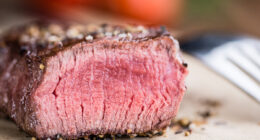 Close-up shot of grilled beef on a vintage background