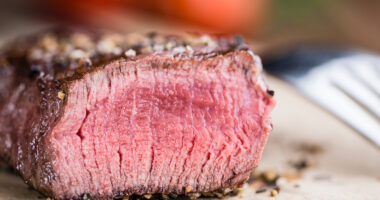 Close-up shot of grilled beef on a vintage background