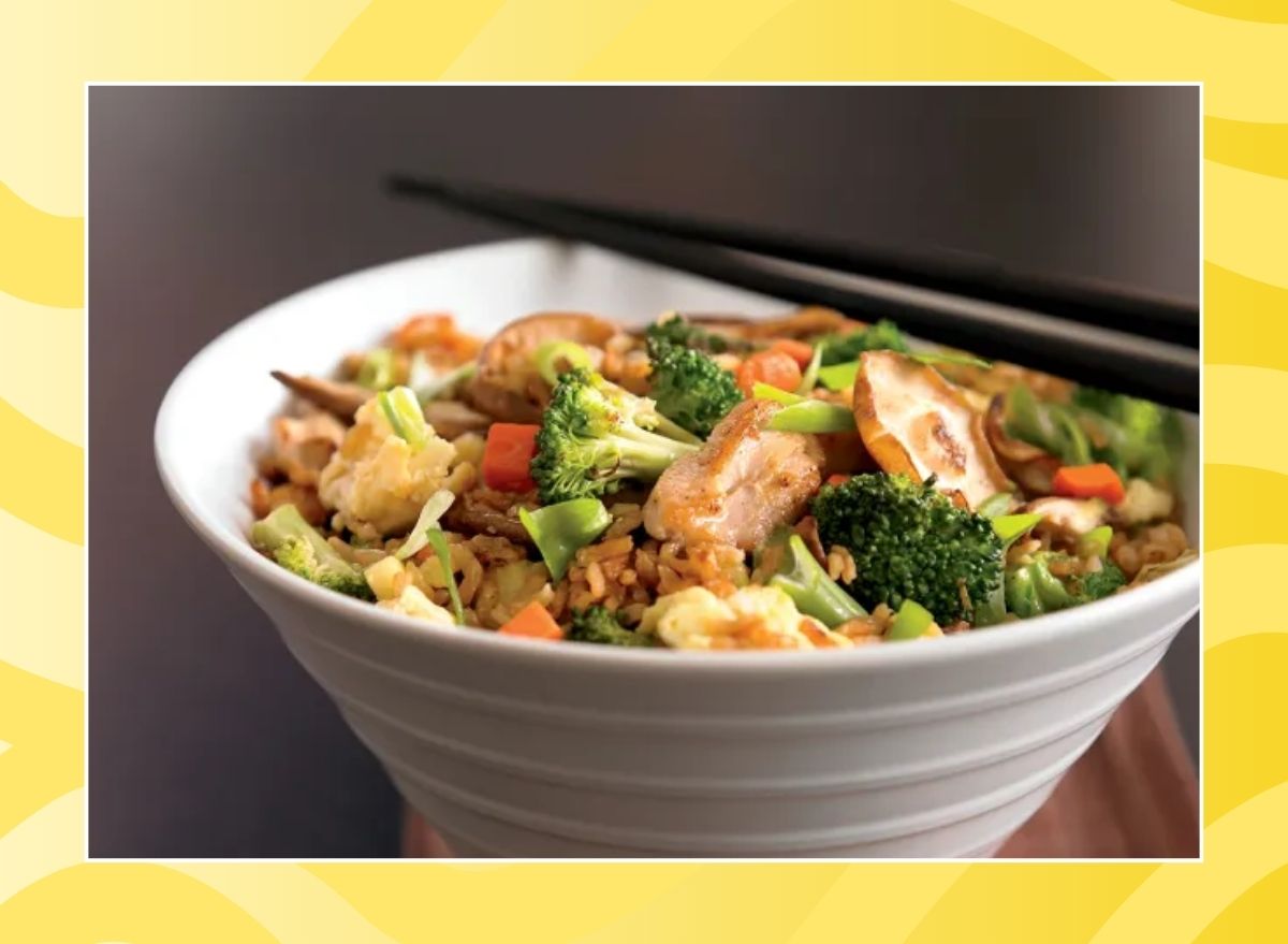 bowl of chicken fried rice on a yellow background