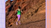 fit woman running uphill on a desert run