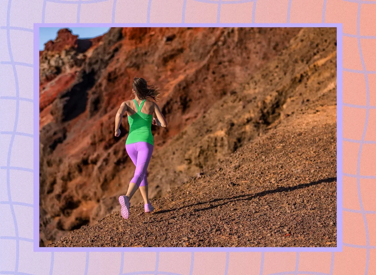 fit woman running uphill on a desert run