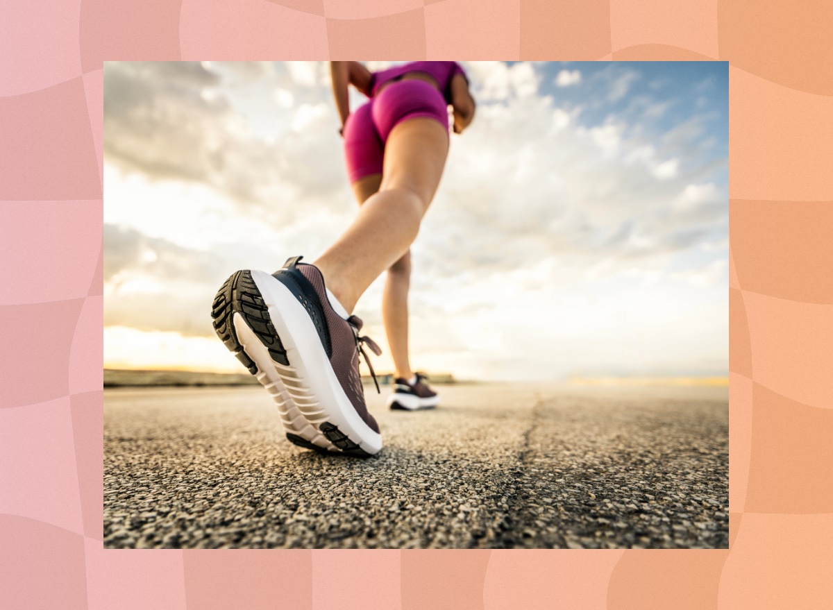 close-up of woman power walking on road on sunny day