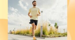 happy man running outdoors on paved path on sunny day