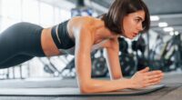 woman doing forearm planks, concept of test how fit you are with a trainer's five-minute test