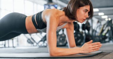 woman doing forearm planks, concept of test how fit you are with a trainer's five-minute test