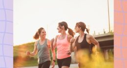 three fit friends walking outdoors for exercise on sunny late afternoon