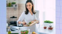 happy woman preparing healthy salad in bright kitchen