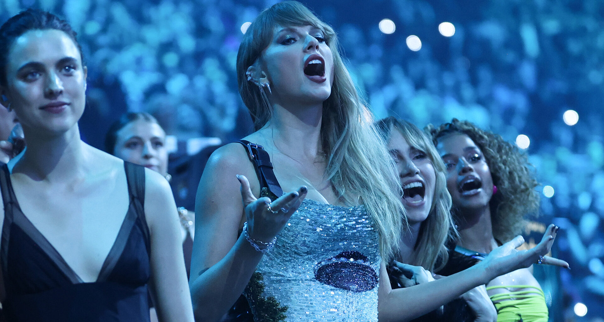 Taylor Swift’s reaction to former enemy Katy Perry nearly kissing Doechii during VMAs performance caught on camera