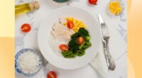 a healthy, portion-controlled plate with rice, chicken, broccoli, and corn