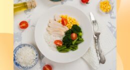 a healthy, portion-controlled plate with rice, chicken, broccoli, and corn