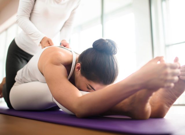 woman doing assisted stretching