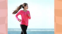 woman power walking on the beach on clear, sunny day