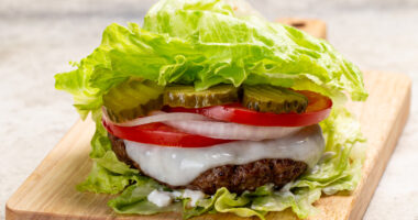 lettuce wrap burger on wooden cutting board