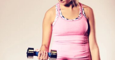 Woman holding dumbbell bicep curls