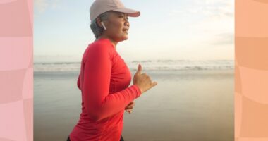 middle-aged woman running on the beach