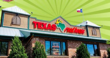 The storefront of a Texas Roadhouse restaurant set against a vibrant background