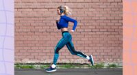 blonde woman with headphones on running outdoors for exercise