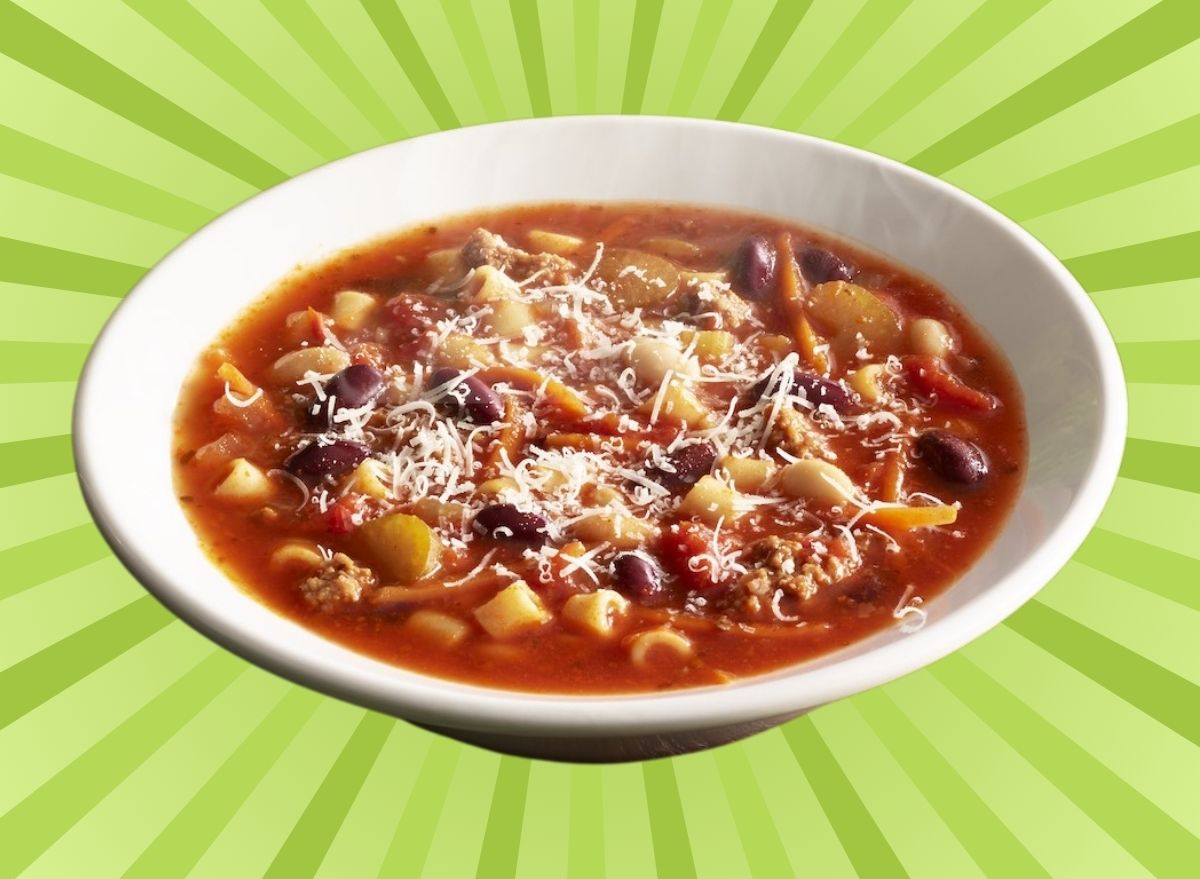 Bowl of Olive Garden Minestrone set on green background