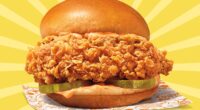 Popeyes new Ghost Pepper Chicken Sandwich set against a vibrant background.