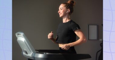 fit, focused brunette woman in black t-shirt and leggings walking on treadmill