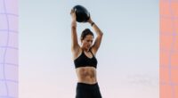 fit woman doing med ball slam