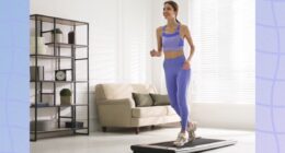 fit woman doing treadmill walking pad workout at home in bright living space