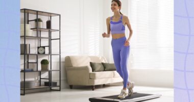 fit woman doing treadmill walking pad workout at home in bright living space