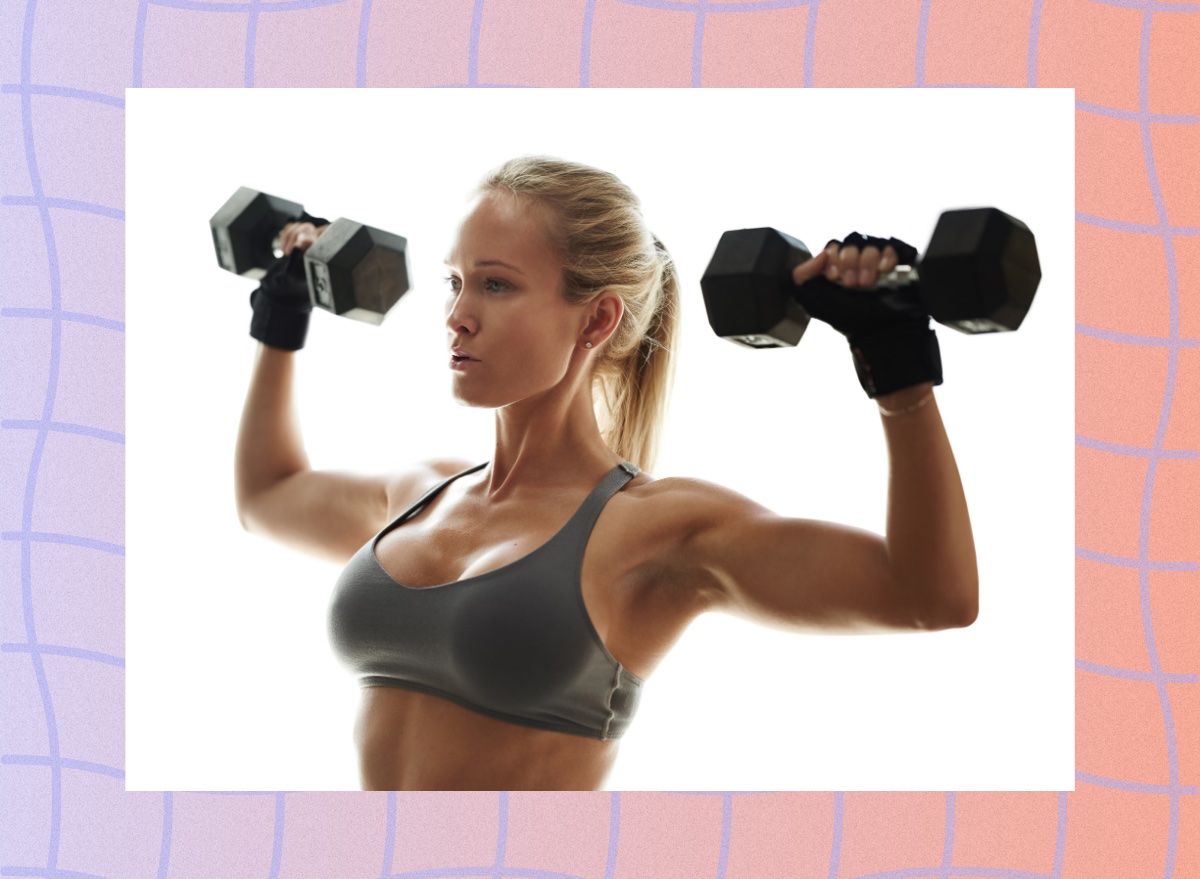 fit, blonde woman doing dumbbell press exercise in bright space